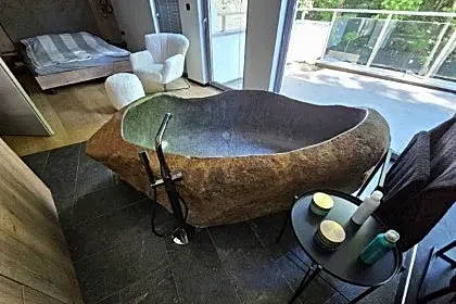 A Real Natural Stone Bathtub in the Bedroom? Why Not.